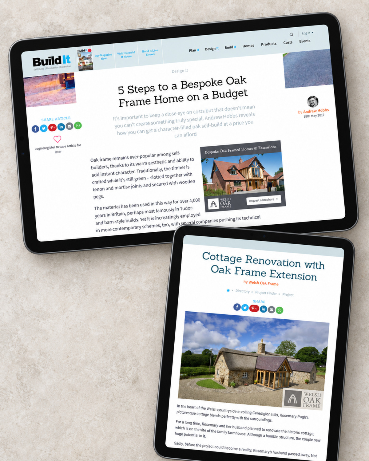 Two tablets showing Build It magazine pages, with an article titled 5 Steps to a Bespoke Oak Frame Home on a Budget beside a Welsh Oak Frame display advertisement, and a project page titled Cottage Renovation with Oak Frame Extension