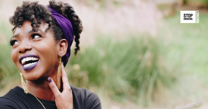 A smiling woman with the Stop Smoking London logo prominently displayed in the corner